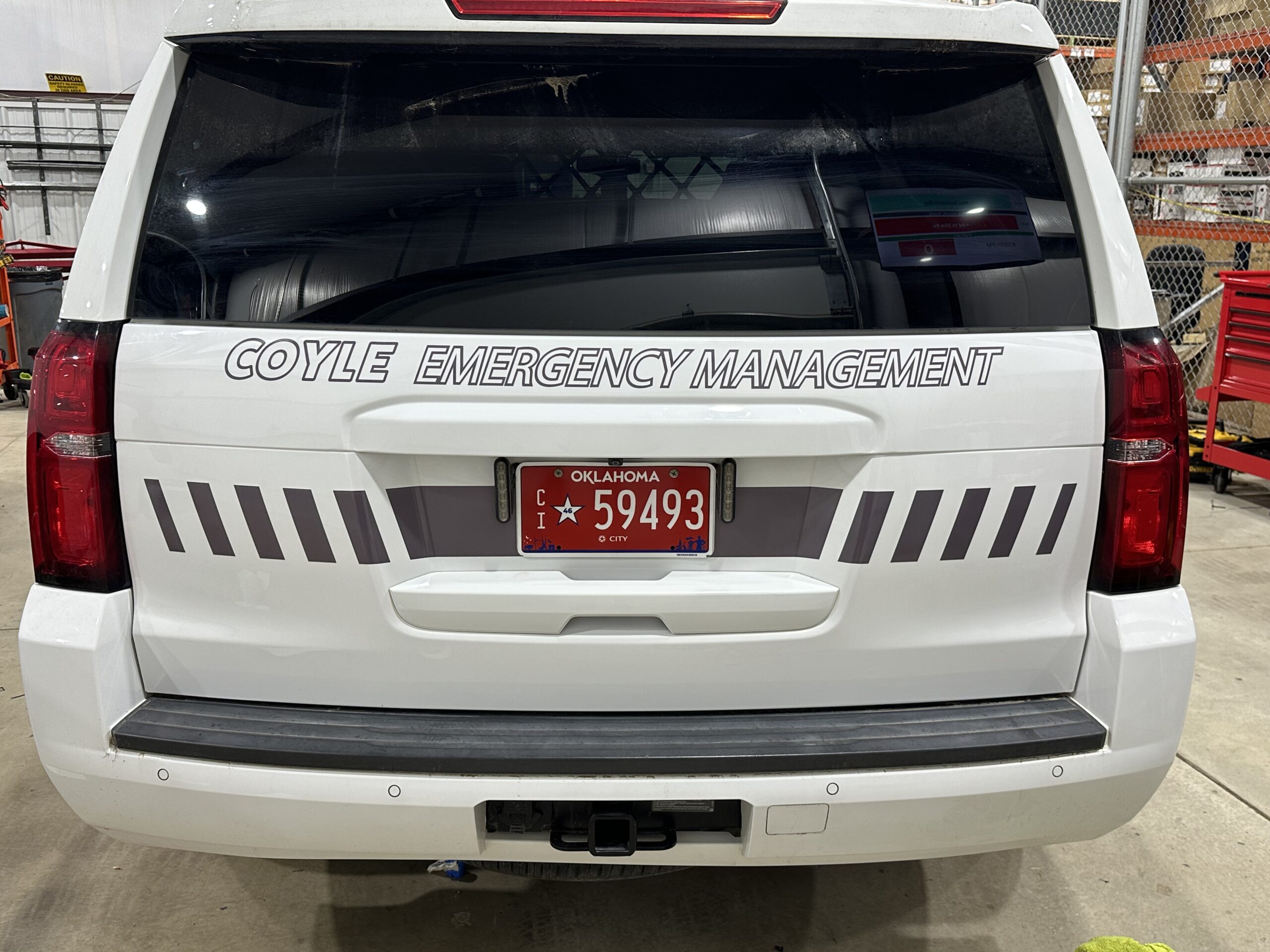 Rear graphics on a Coyle public safety Tahoe completed by Metro Emergency Upfitters