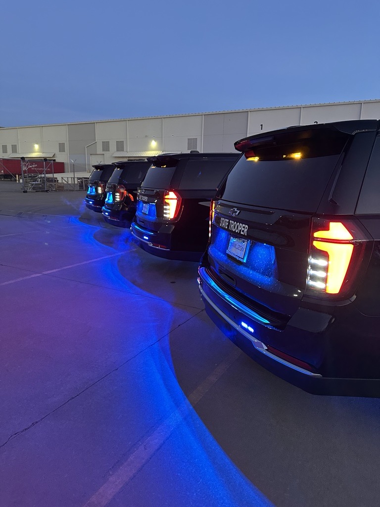 Highway patrol fleet with coordinated emergency vehicle graphics