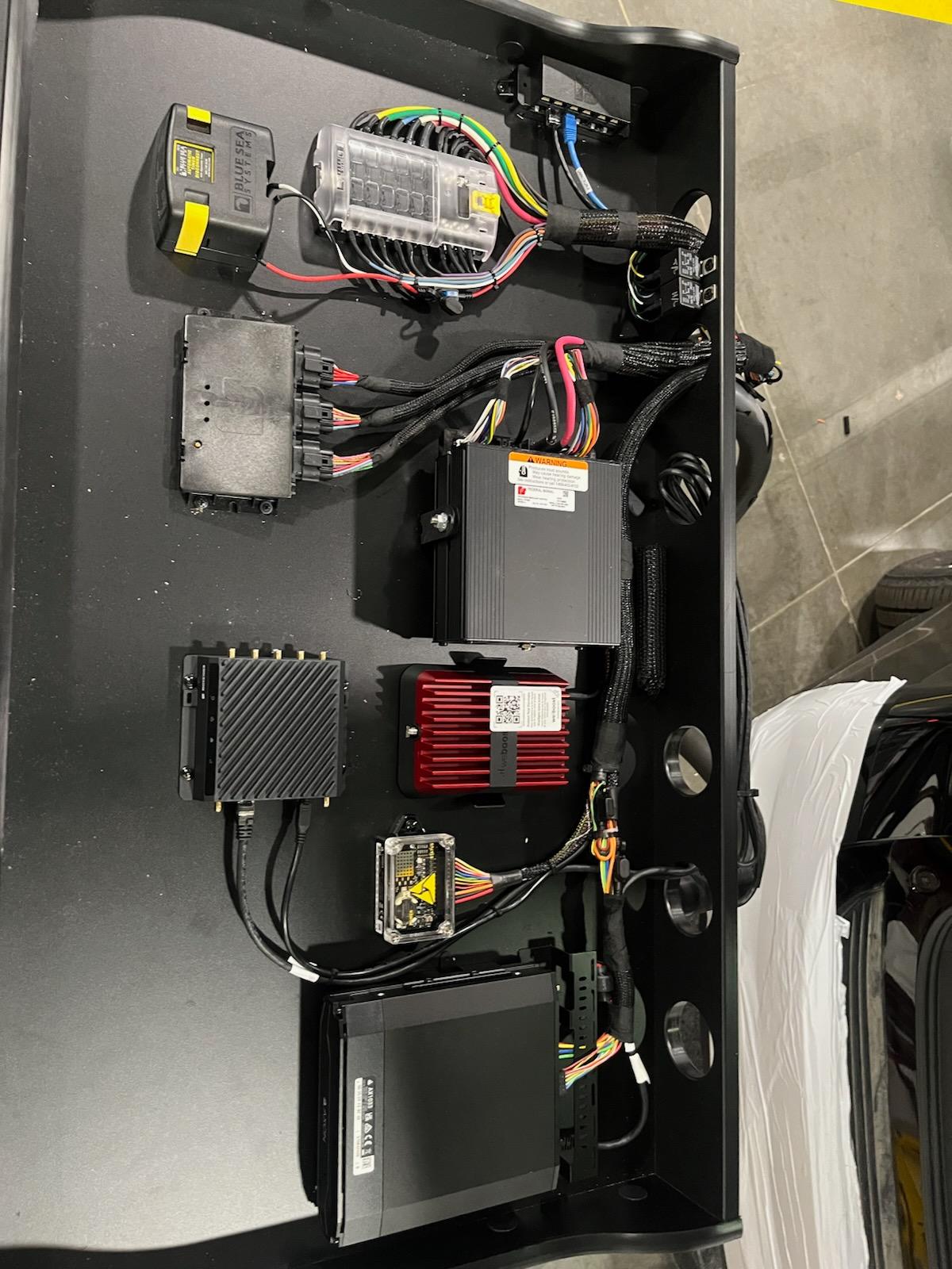 Completed specialty wire tray and equipment organization installation by Metro Emergency Upfitters